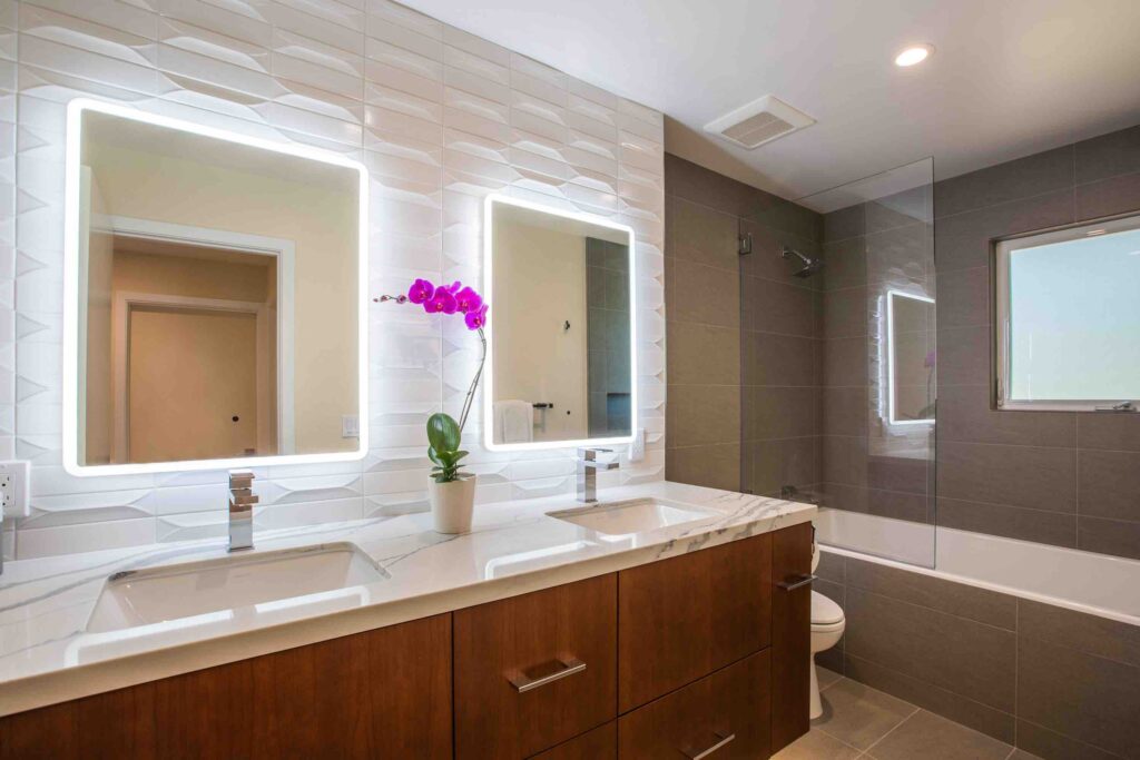 Modern Remodeled Bathroom with Backlit Dual Mirrors and Sinks, Marble Countertop, Stone Tiles, White Backsplash, Wine Country, Sonoma, California