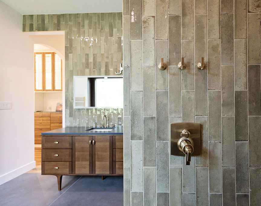 walk in shower remodel Los Angeles brushed brass fixtures vertical tile custom bathroom design
